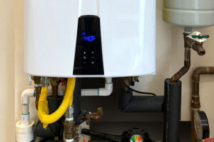 What Is a Point-of-Use Tankless Water Heater? Photo of a tankless water heater.